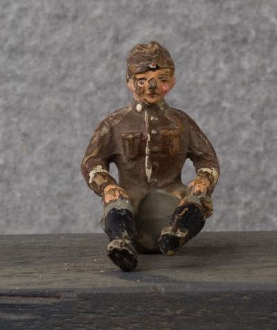 WWII German Toy Seated Soldier 